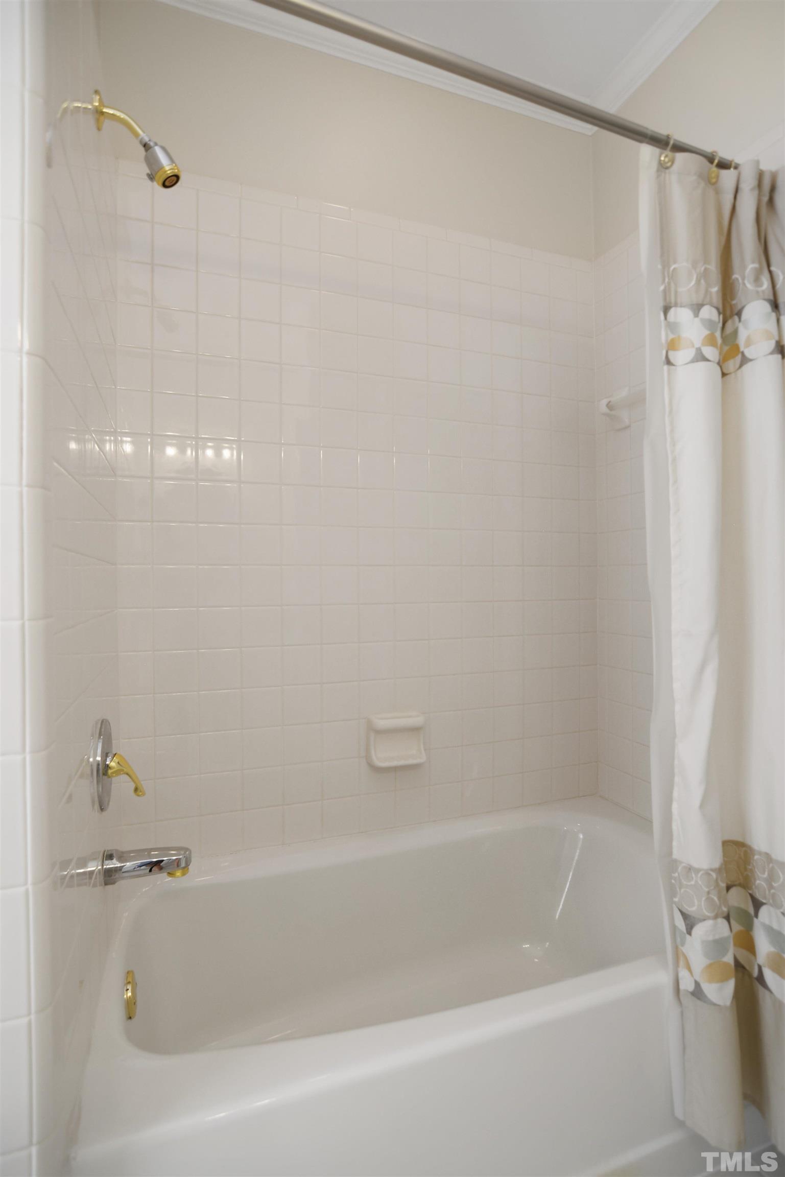 900 Tanworth Drive Raleigh, NC 27615 - Photo 17 of 26 a bathroom with a bathtub