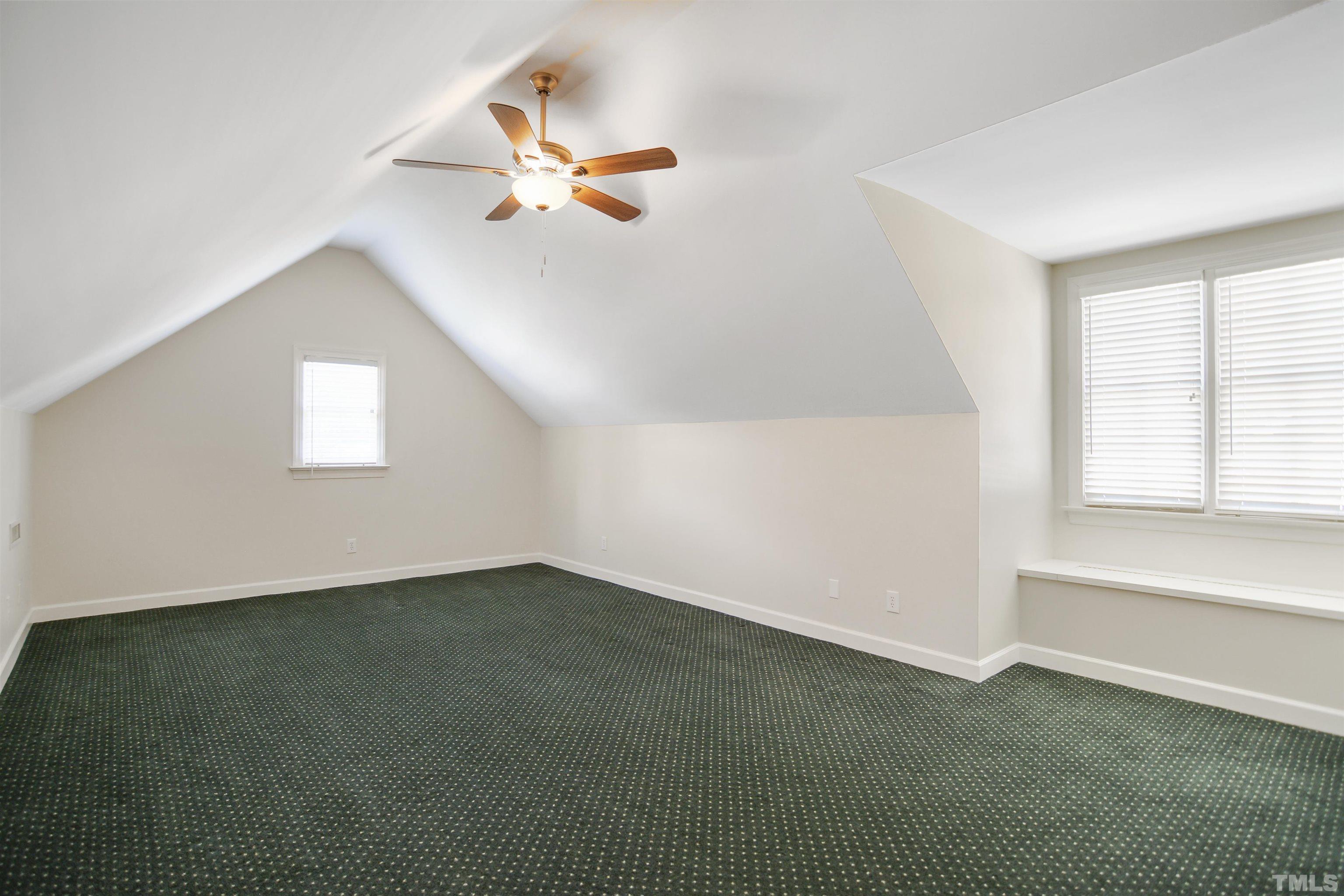 900 Tanworth Drive Raleigh, NC 27615 - Photo 18 of 26 an empty room with windows and fan