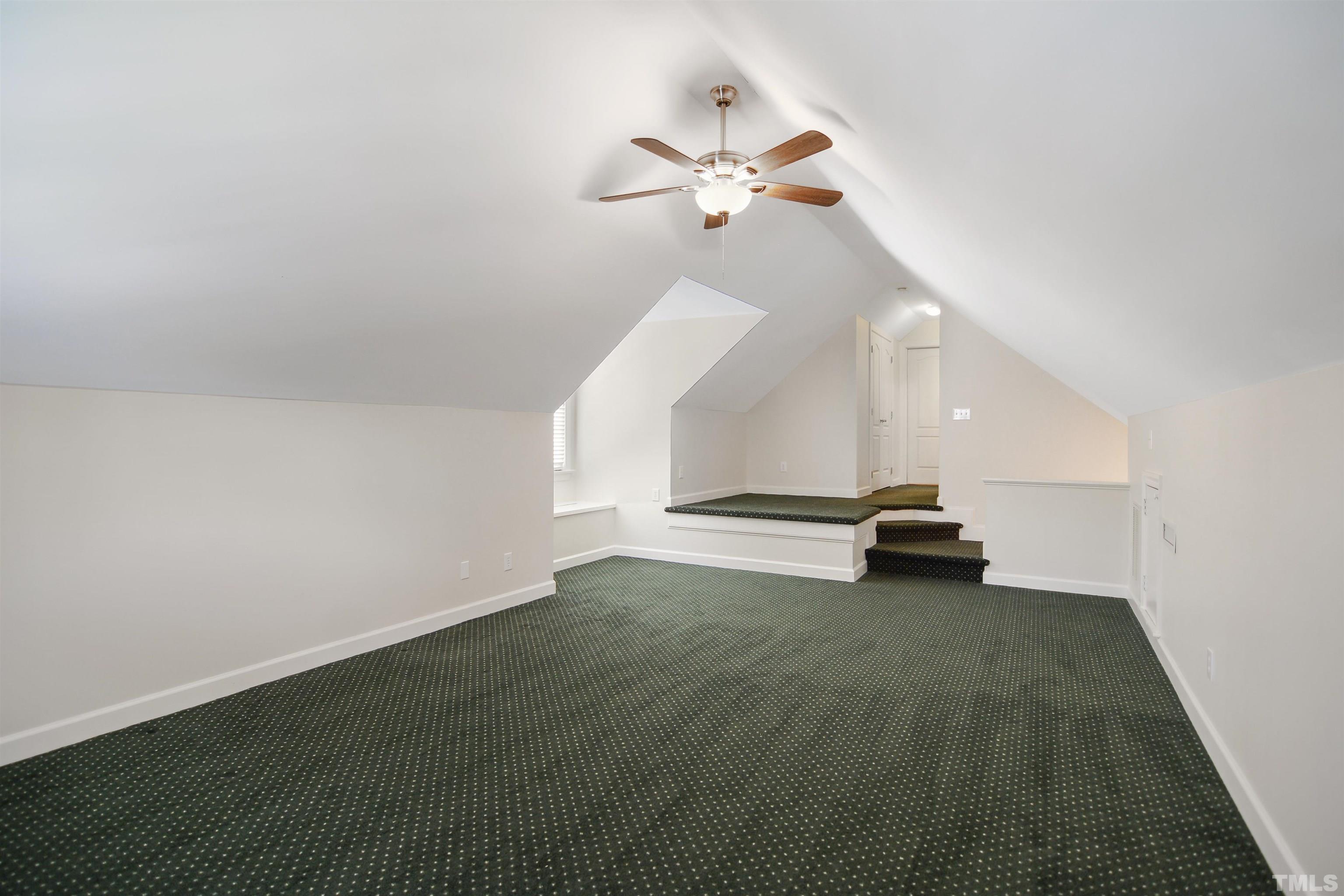 900 Tanworth Drive Raleigh, NC 27615 - Photo 19 of 26 an empty room with wooden floor and windows