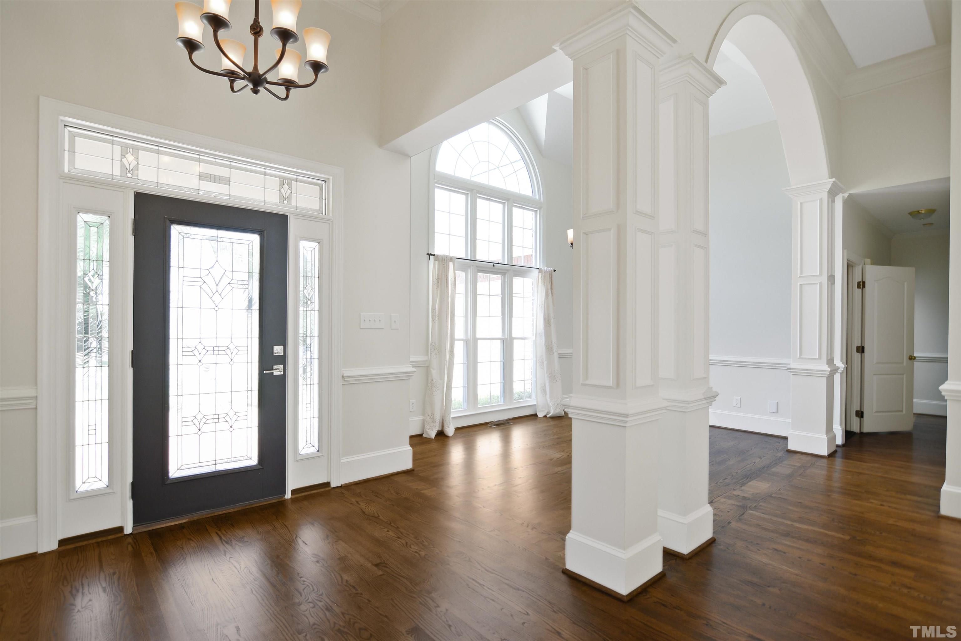 900 Tanworth Drive Raleigh, NC 27615 - Photo 2 of 26 a view of empty room with wooden floor and fan