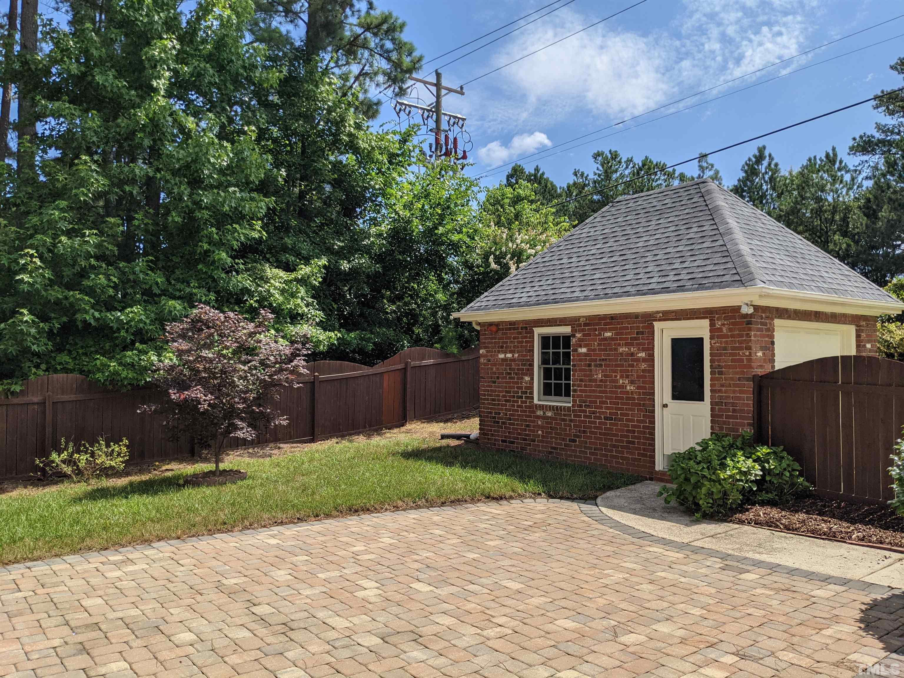 900 Tanworth Drive Raleigh, NC 27615 - Photo 25 of 26 a aerial view of a house next to a yard and large trees