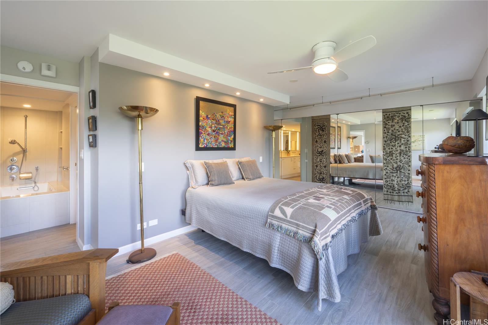 1022 Prospect Street, Unit 903E Honolulu, HI 96813 - Photo 12 of 25 a bed room with a bed and a couch