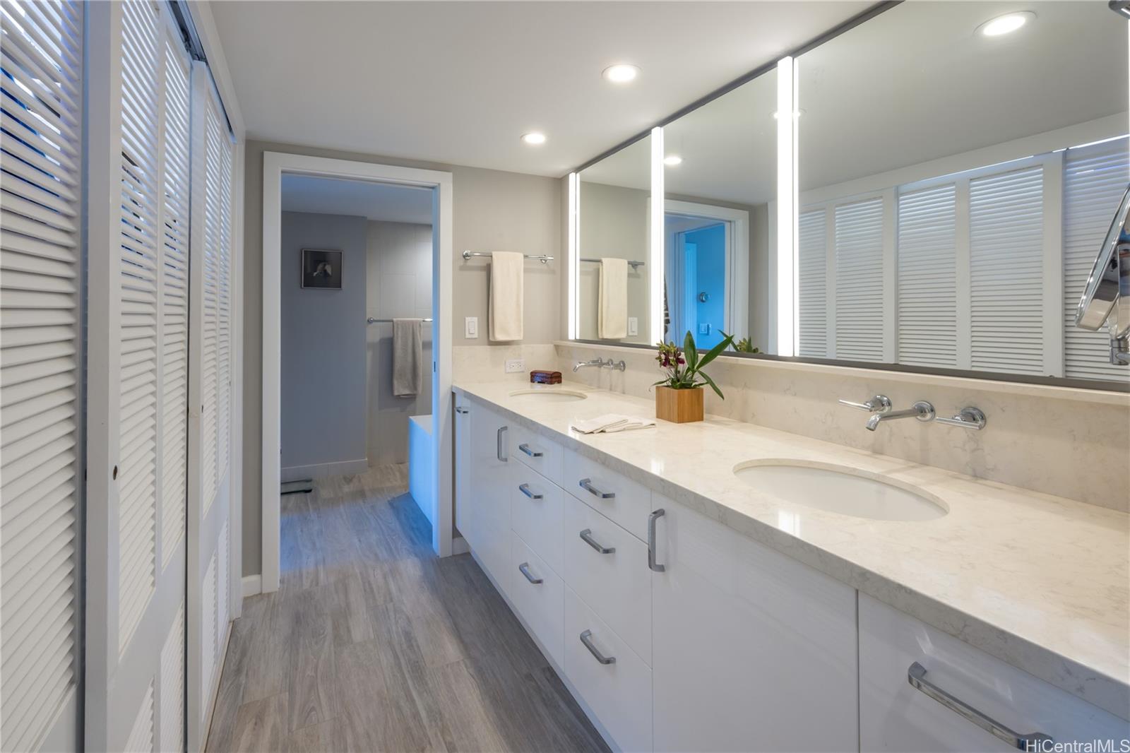 1022 Prospect Street, Unit 903E Honolulu, HI 96813 - Photo 15 of 25 a spacious bathroom with a double vanity sink and a mirror