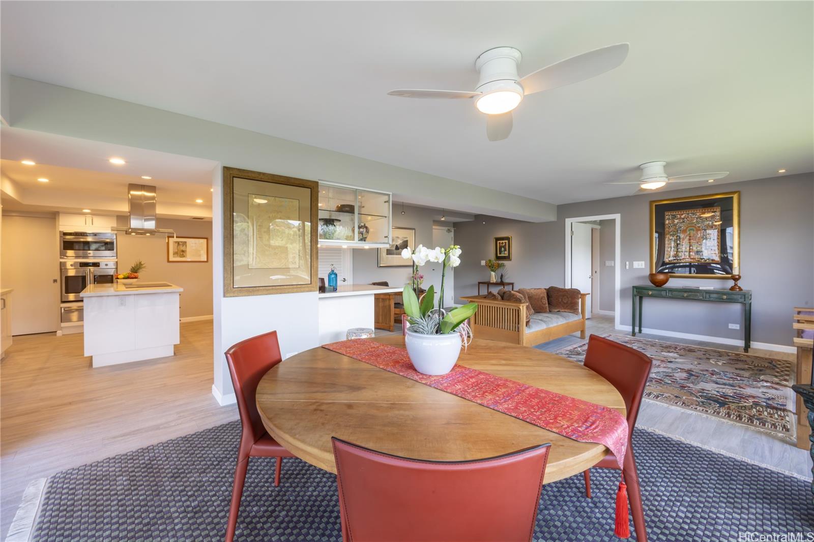 1022 Prospect Street, Unit 903E Honolulu, HI 96813 - Photo 7 of 25 a dining room with furniture and wooden floor