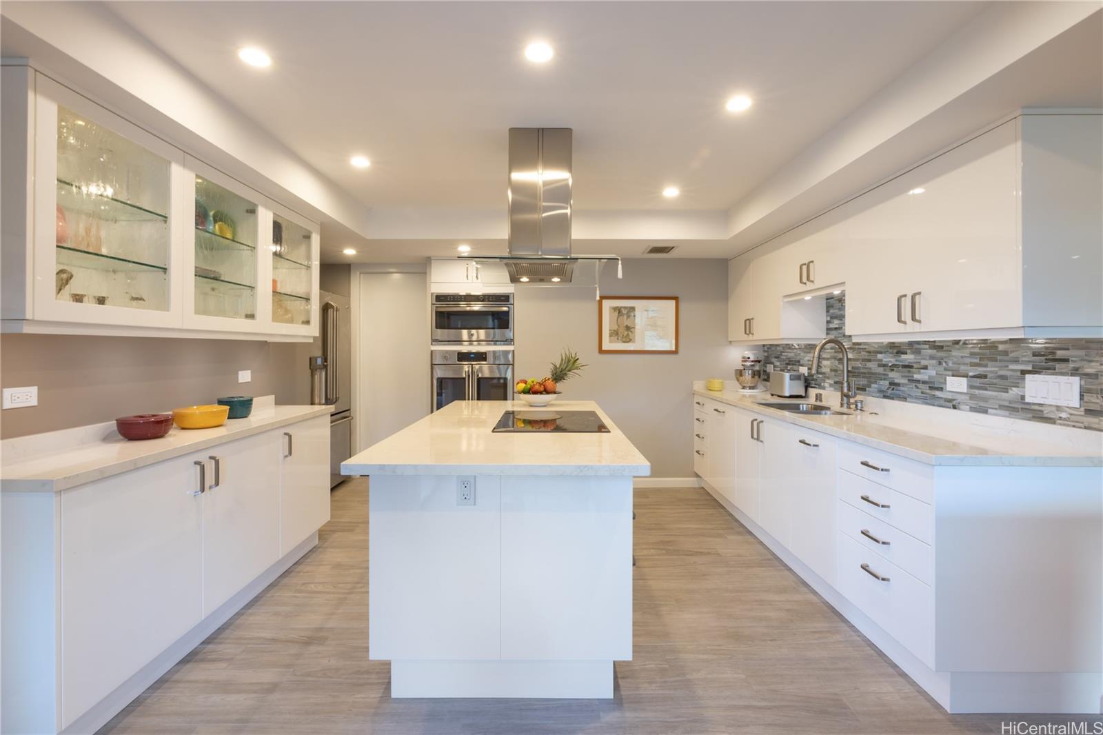 1022 Prospect Street, Unit 903E Honolulu, HI 96813 - Photo 10 of 25 a kitchen with stainless steel appliances granite countertop a sink and cabinets