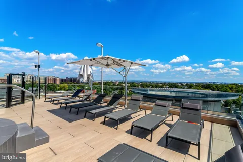 a outdoor space with patio furniture and a fireplace