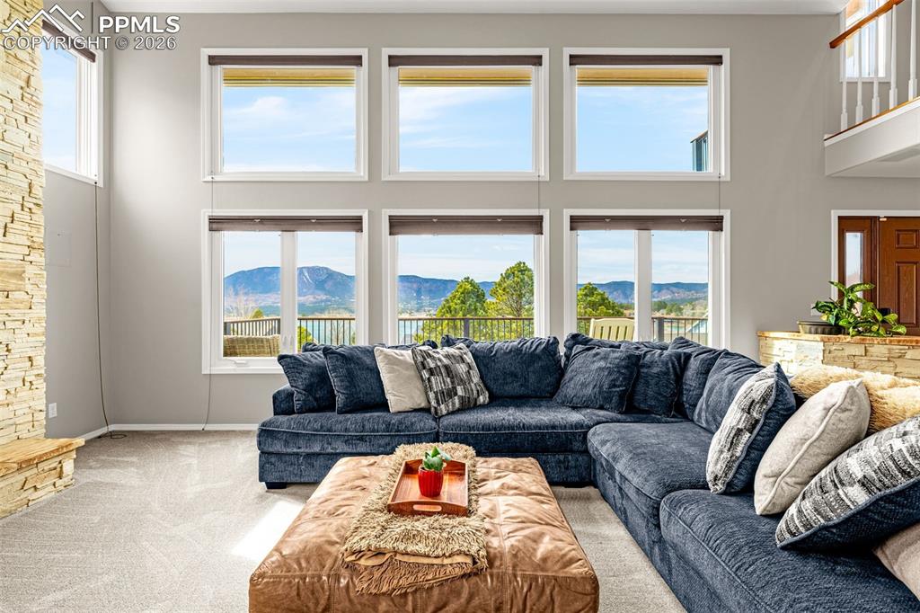 18475 Lower Lake Road Monument, CO 80132 - Photo 12 of 50 a living room with furniture and a large window
