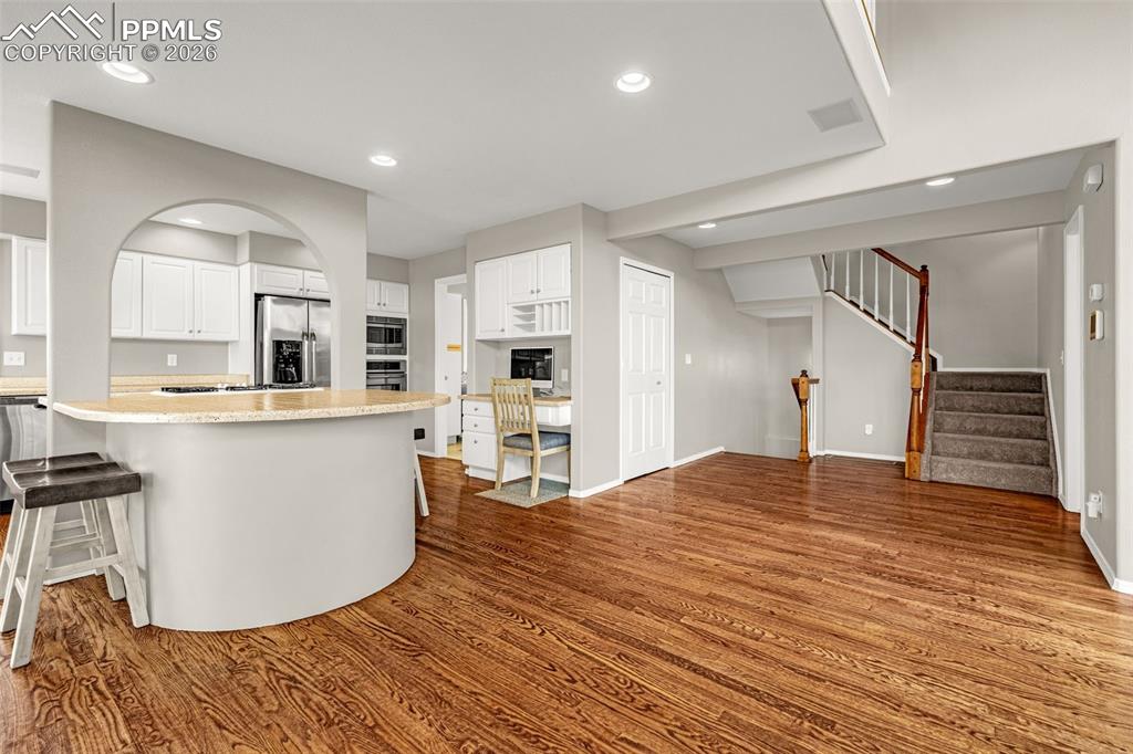 18475 Lower Lake Road Monument, CO 80132 - Photo 13 of 50 a view of kitchen with cabinets and wooden floor