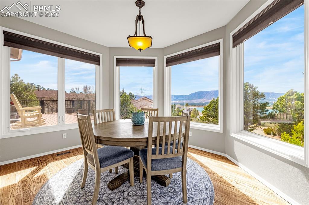 18475 Lower Lake Road Monument, CO 80132 - Photo 18 of 50 a view of a dining room with furniture window and outside view