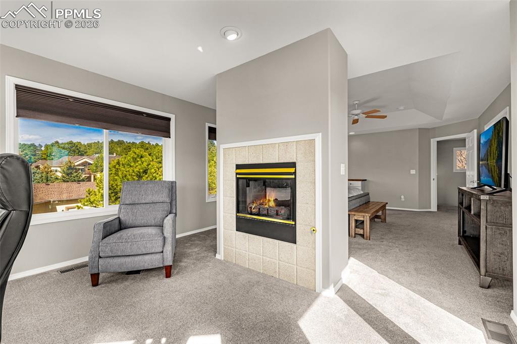 18475 Lower Lake Road Monument, CO 80132 - Photo 22 of 50 a living room with furniture and a large window