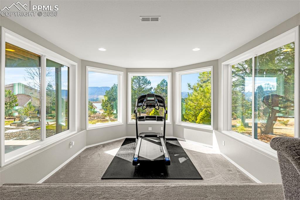 18475 Lower Lake Road Monument, CO 80132 - Photo 29 of 50 a living room with large window and furniture
