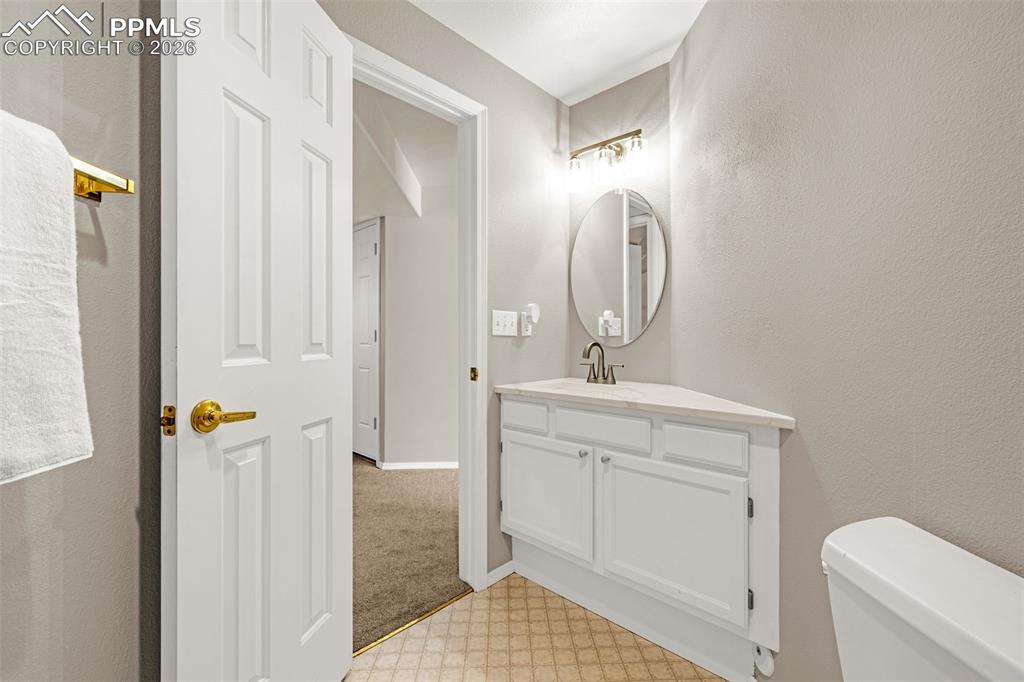 18475 Lower Lake Road Monument, CO 80132 - Photo 38 of 50 a bathroom with a sink a toilet and shower