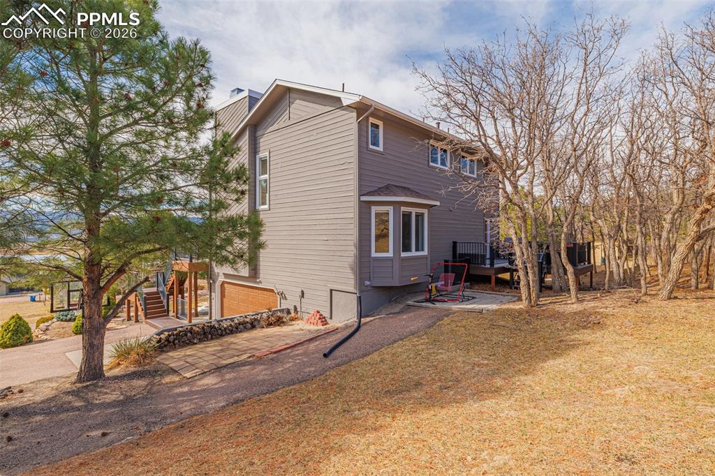 18475 Lower Lake Road Monument, CO 80132 - Photo 39 of 50 a view of a house with snow on the wall