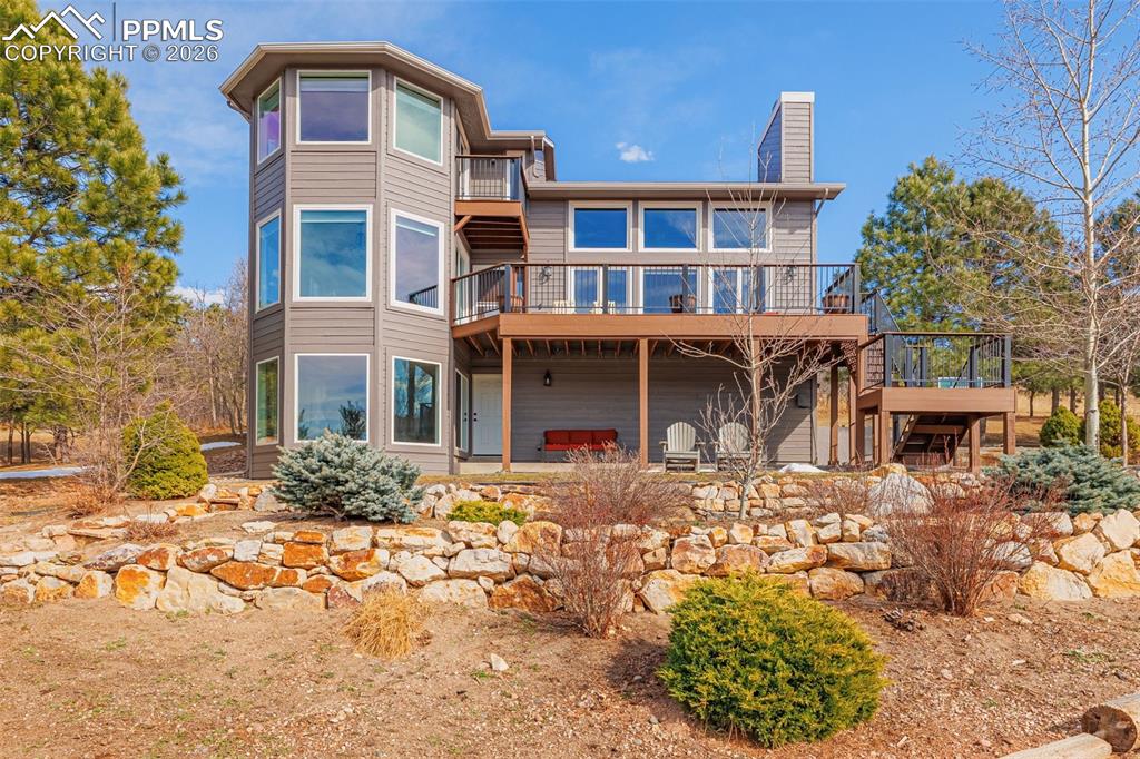 18475 Lower Lake Road Monument, CO 80132 - Photo 45 of 50 a front view of a house with a yard