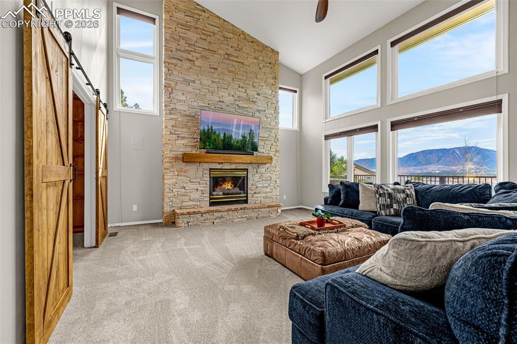 18475 Lower Lake Road Monument, CO 80132 - Photo 9 of 50 a living room with furniture and a fireplace