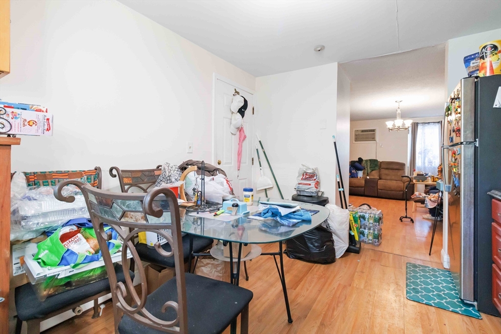 1 19th Street, Unit 3 Lowell, MA 01850 - Photo 11 of 22 a view of a dining room with furniture and a wooden floor