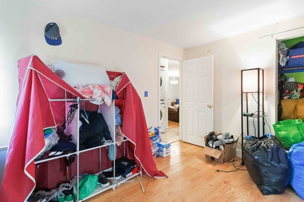 1 19th Street, Unit 3 Lowell, MA 01850 - Photo 12 of 22 a view of walk in closet with clothes and shoes