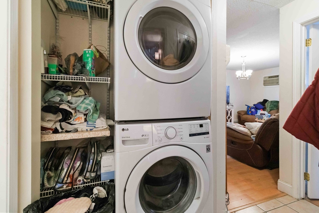 1 19th Street, Unit 3 Lowell, MA 01850 - Photo 18 of 22 a view of a hallway with washer and dryer