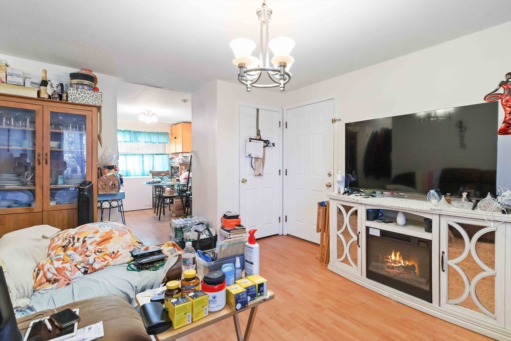 1 19th Street, Unit 3 Lowell, MA 01850 - Photo 6 of 22 a view of a livingroom with furniture and a flat screen tv