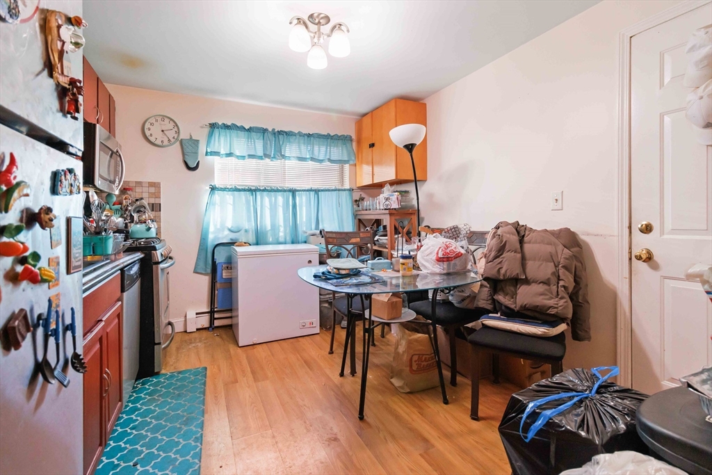 1 19th Street, Unit 3 Lowell, MA 01850 - Photo 9 of 22 a view of a dining room with furniture window and wooden floor