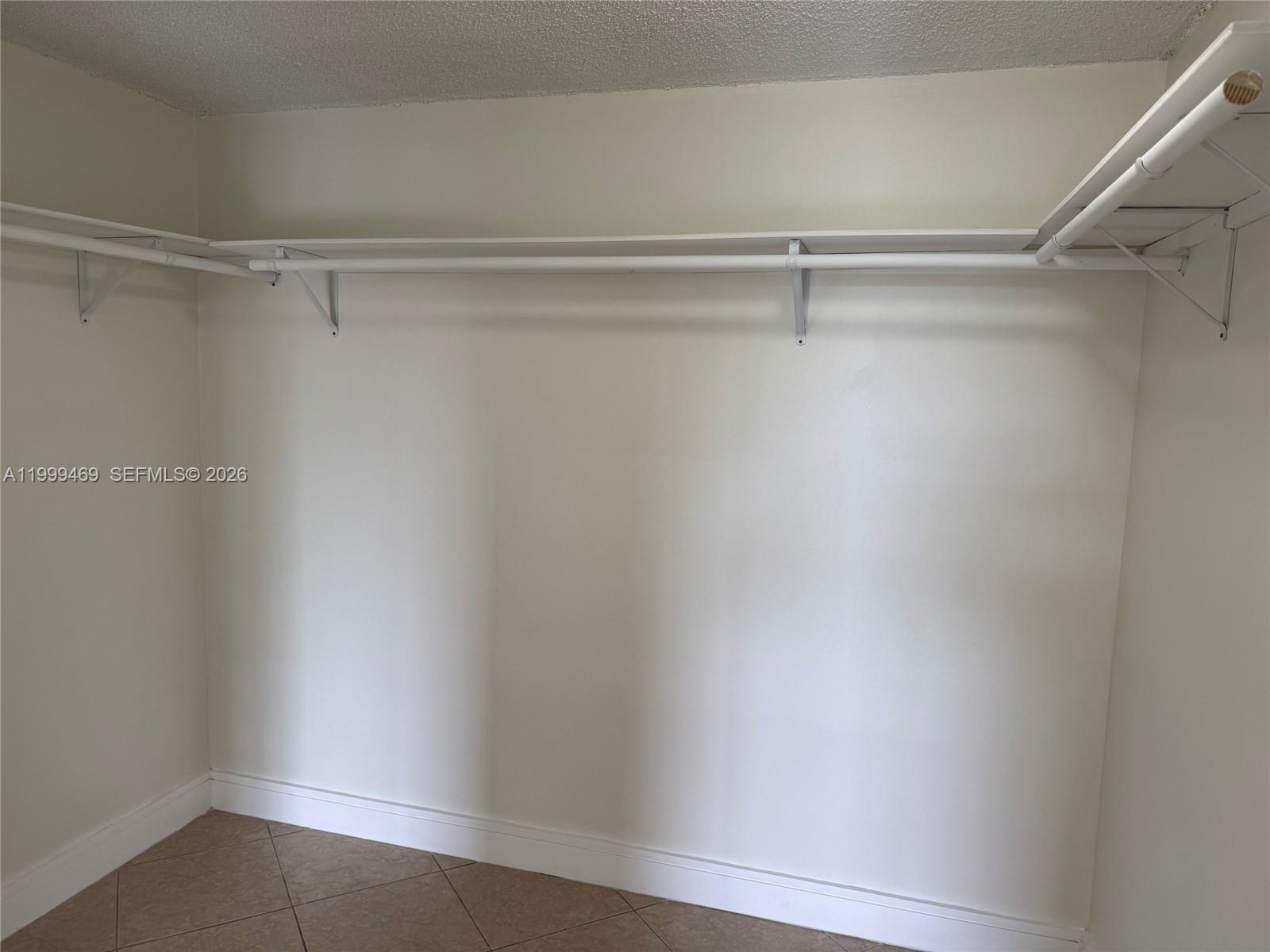 492 Northwest 165th Street, Unit C309 Miami, FL 33169 - Photo 13 of 15 a view of an empty walk in closet