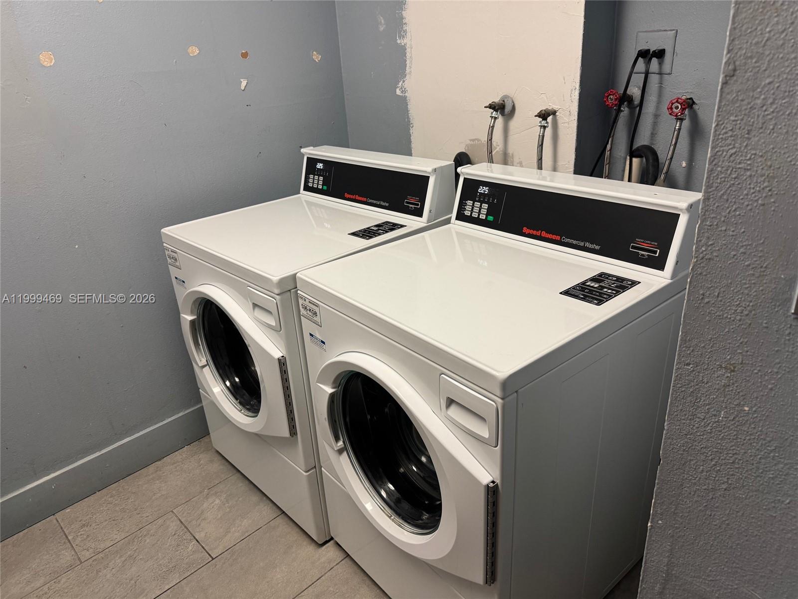 492 Northwest 165th Street, Unit C309 Miami, FL 33169 - Photo 15 of 15 a utility room with dryer and washer