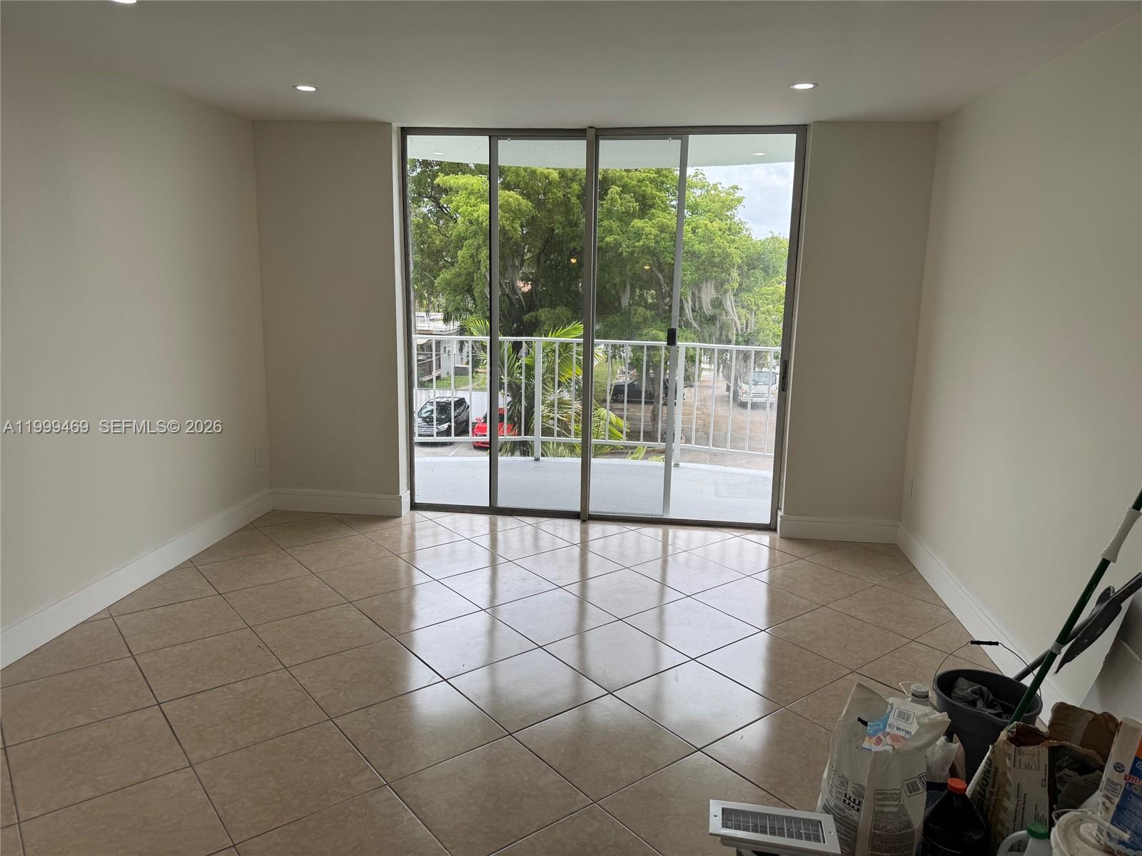 492 Northwest 165th Street, Unit C309 Miami, FL 33169 - Photo 5 of 15 a view of a room with a large window