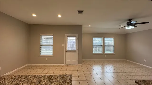 a view of an empty room and window