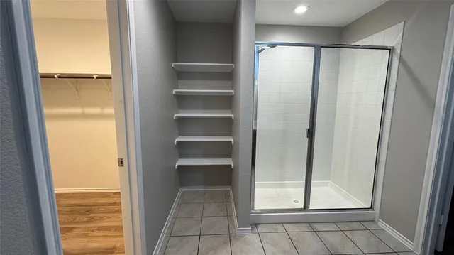 a view of a room with shelf on the wall