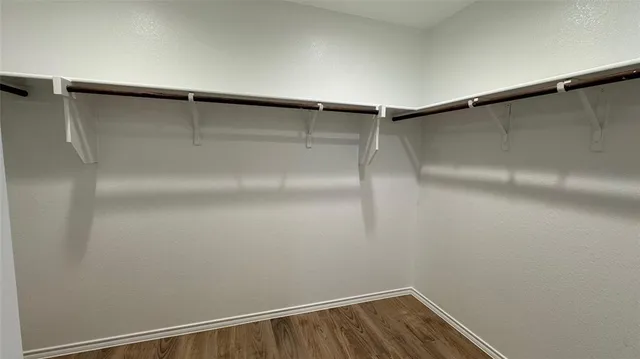 a view of a room with shelf on the wall