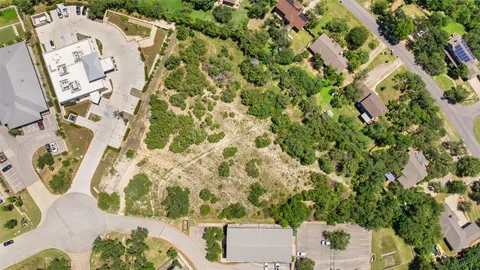 an aerial view of residential house with parking