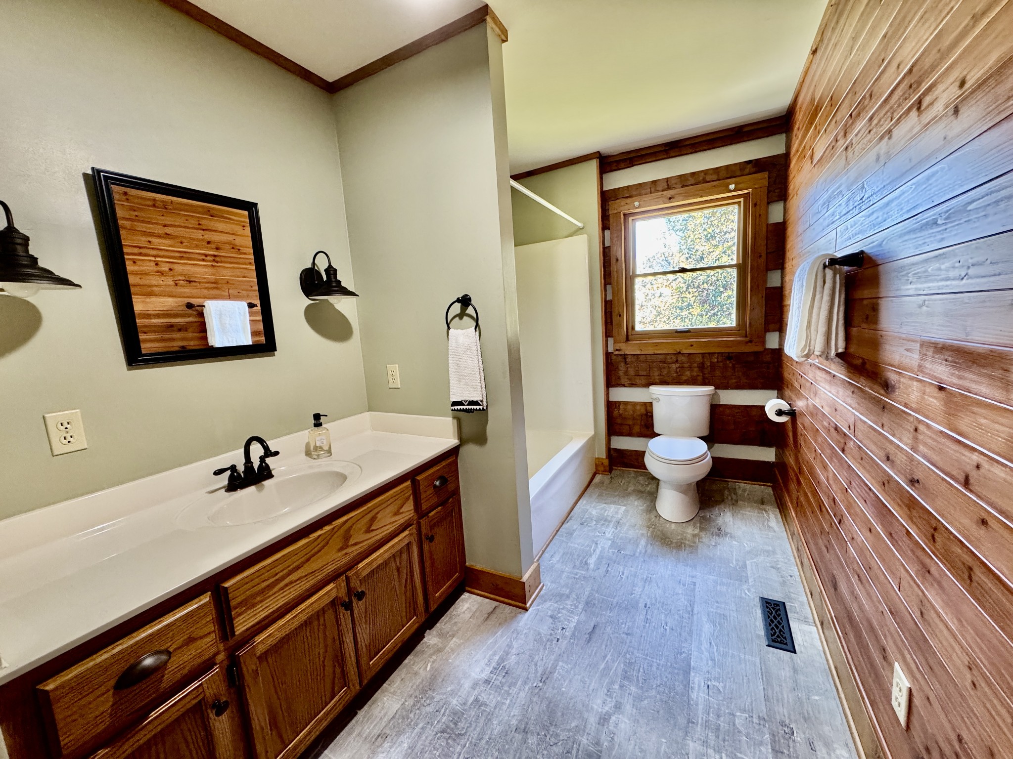 1342 Aetna Church Road Centerville, TN 37033 - Photo 25 of 59 a bathroom with a sink a mirror and a toilet