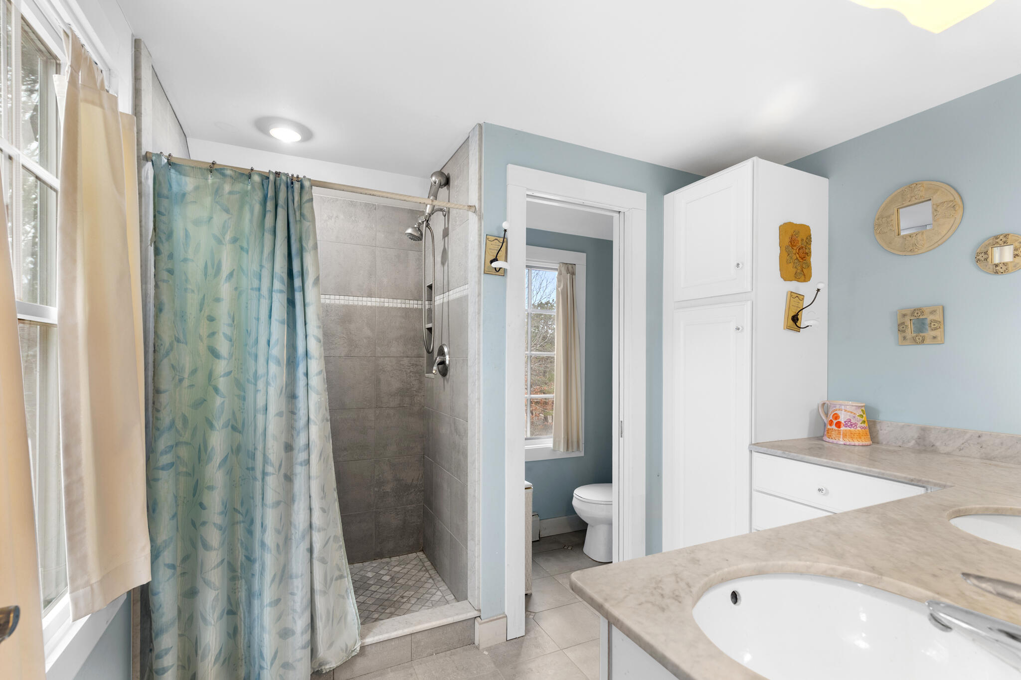311 South Sunken Meadow Road Eastham, MA 02642 - Photo 42 of 57 a bathroom with a sink toilet and shower