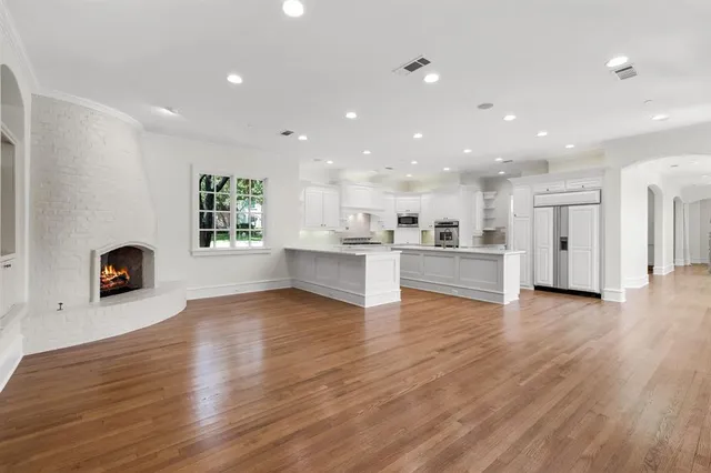 a view of a kitchen with a sink and a refrigerator
