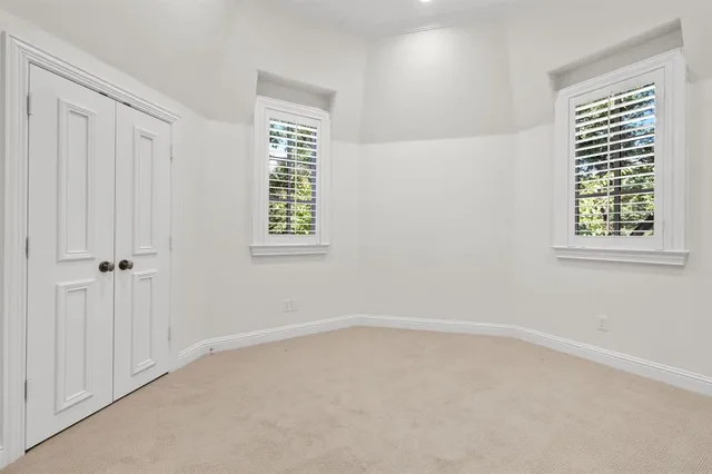 a big room with windows and closet