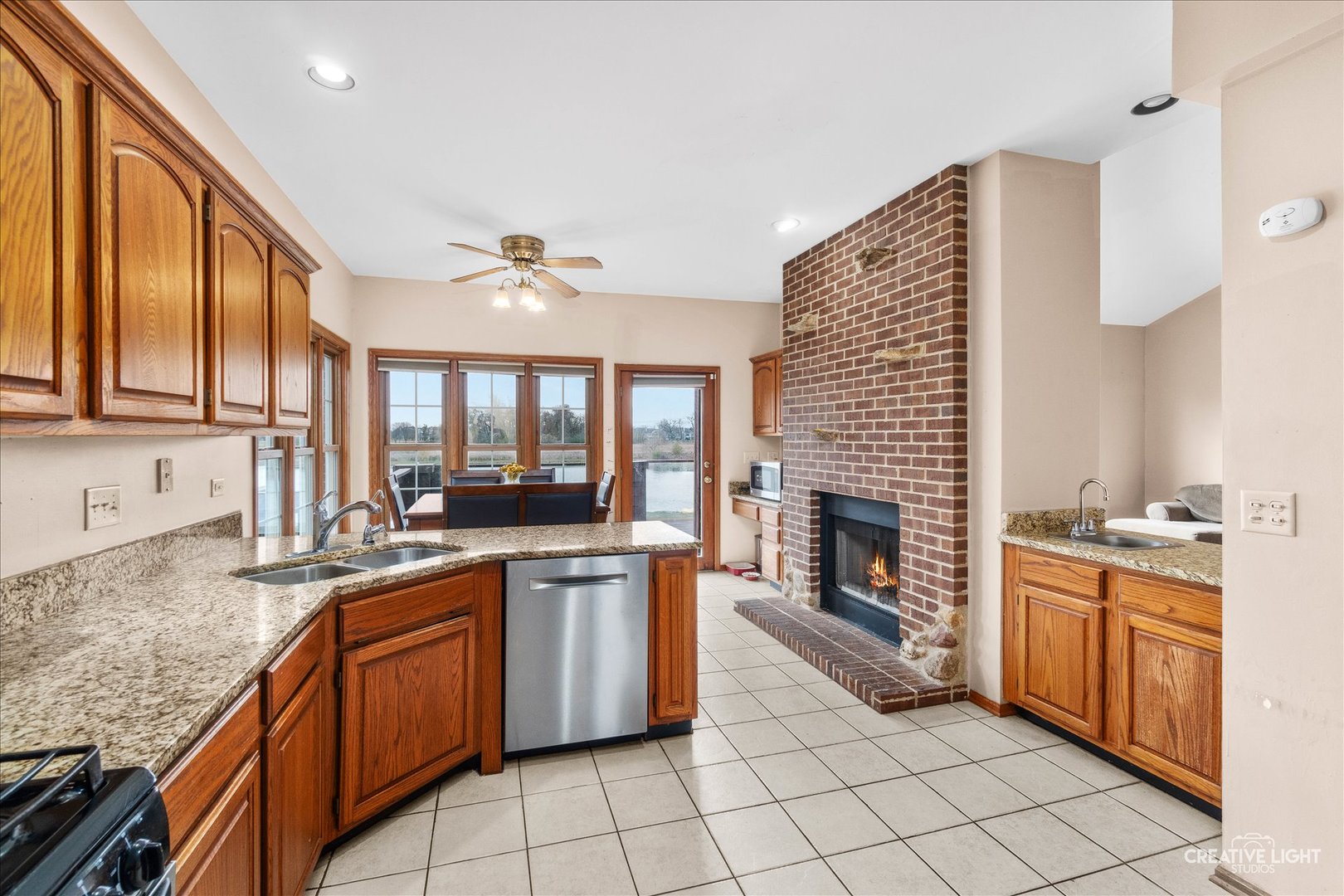 675 White Pine Circle Lake In The Hills, IL 60156 - Photo 11 of 41 a large kitchen with granite countertop a stove sink and cabinets