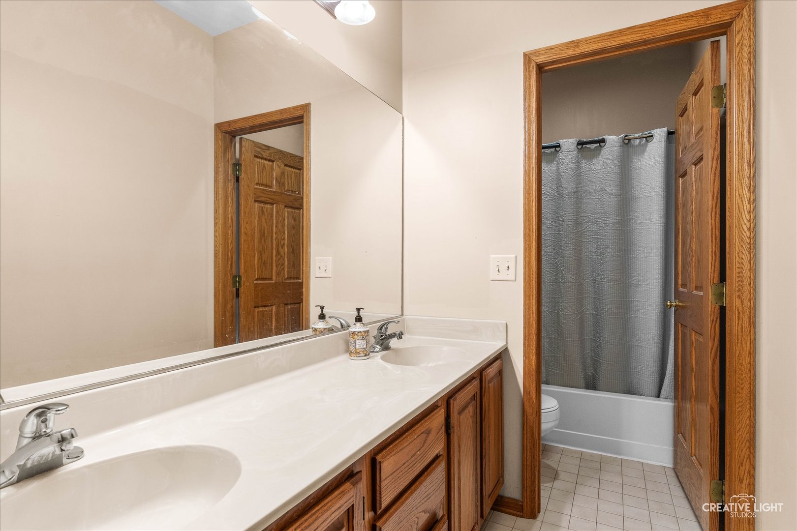 675 White Pine Circle Lake In The Hills, IL 60156 - Photo 16 of 41 a bathroom with a sink and a mirror