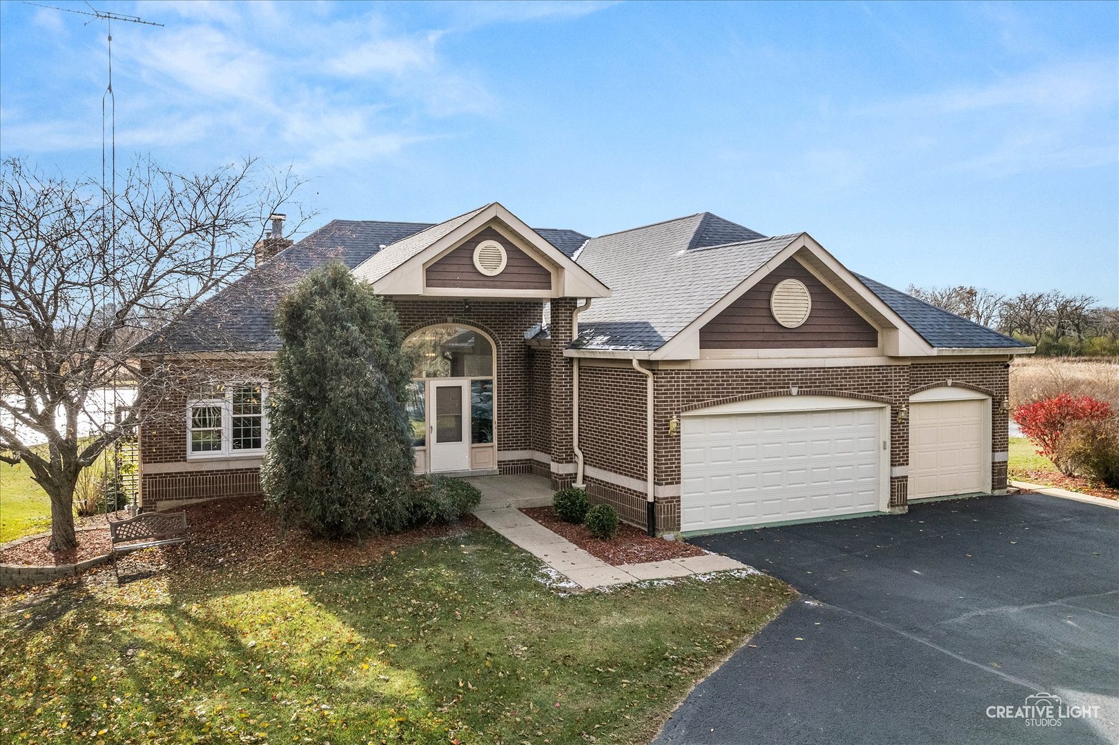 675 White Pine Circle Lake In The Hills, IL 60156 - Photo 2 of 41 a front view of a house with a yard and garage