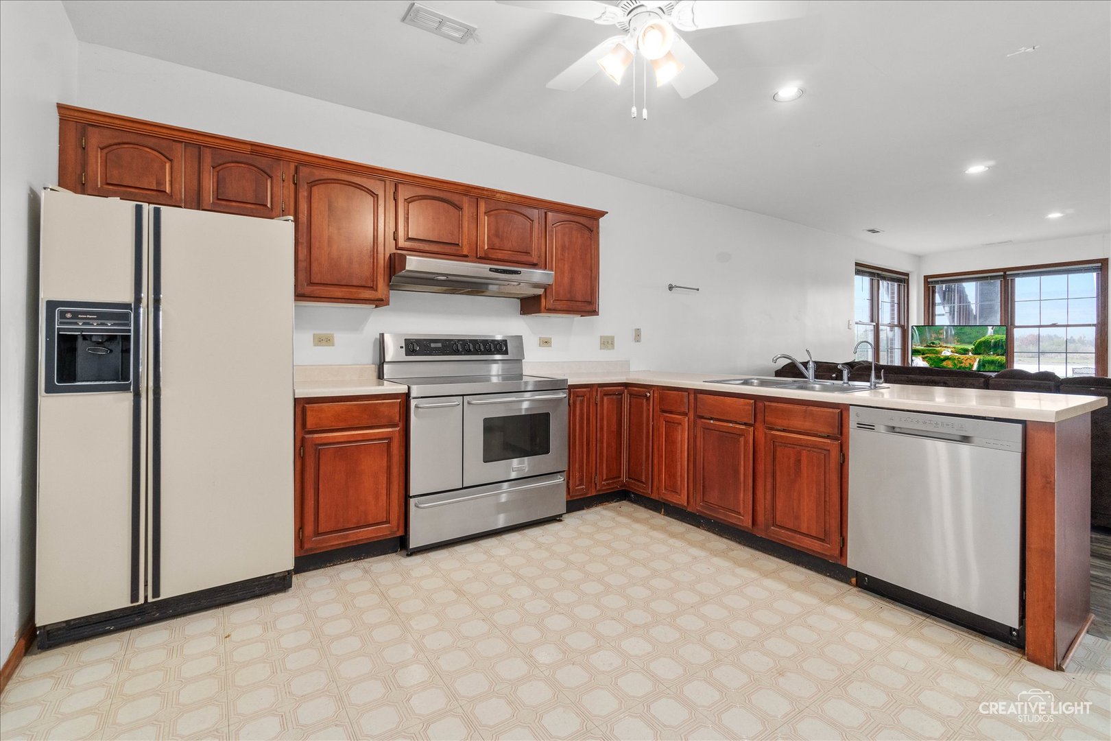 675 White Pine Circle Lake In The Hills, IL 60156 - Photo 22 of 41 a kitchen with stainless steel appliances a sink and a refrigerator