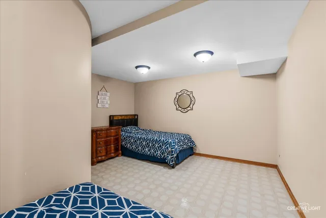 a bedroom with a bed and a table in it