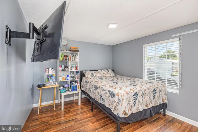 a bedroom with a bed and a table in it