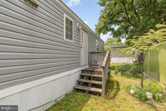 a view of a backyard with sitting area