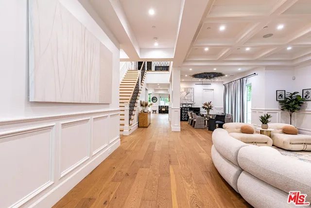 a dining room with furniture and a view of kitchen