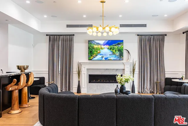 a kitchen with stainless steel appliances granite countertop a sink a stove and refrigerator