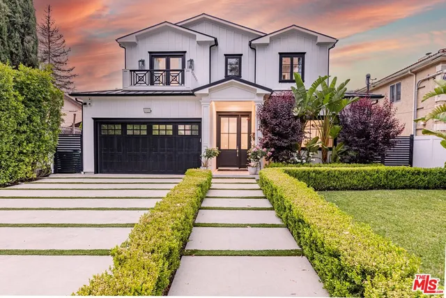a bedroom with a bed and a fireplace