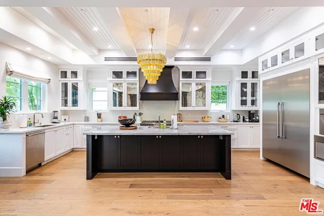 a view of a hallway with windows and stairs