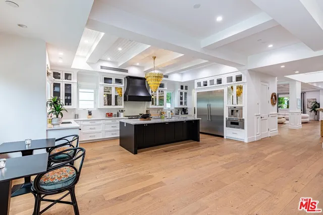 a spacious bedroom with a large bed and a large window