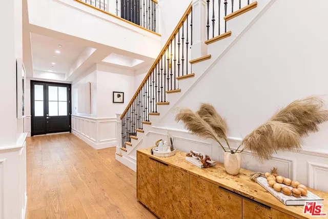 a spacious bedroom with a large bed and a fireplace