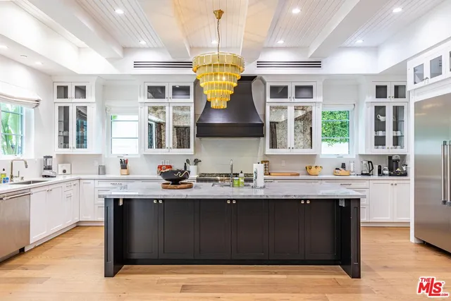 a view of a chairs and table in the patio with a swimming pool