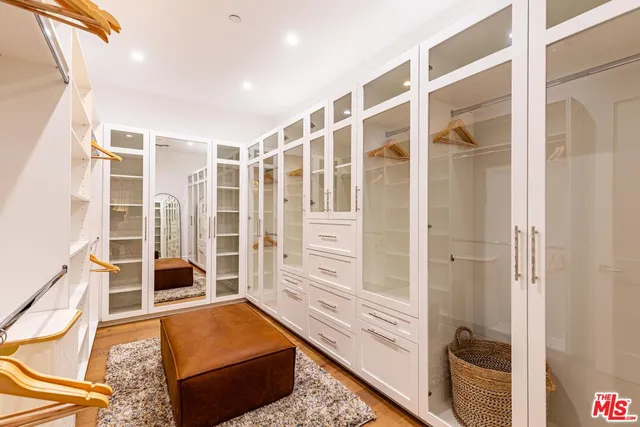 a bathroom with a sink vanity and a toilet